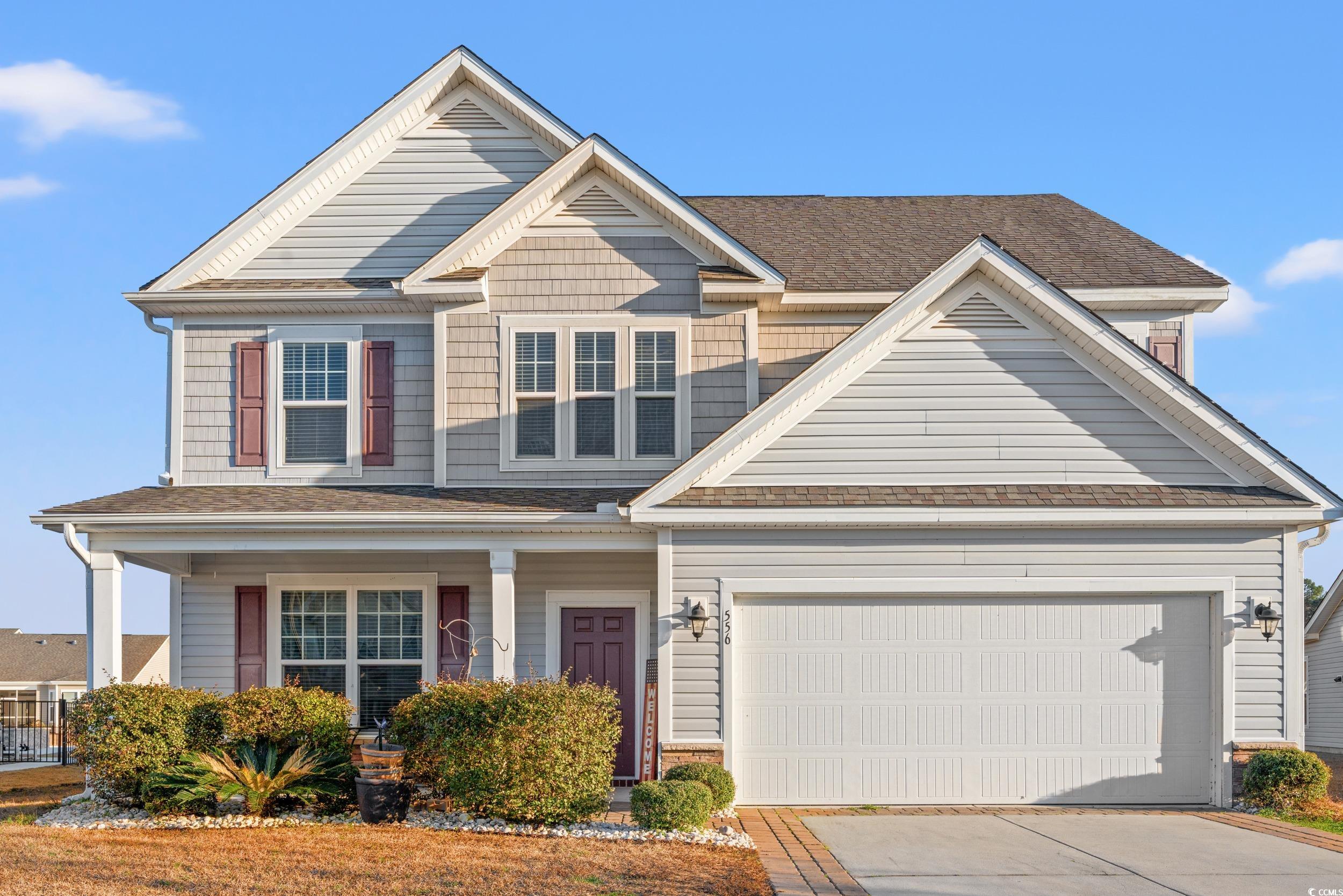 556 Majorca Loop Myrtle Beach, SC 29579 - Photo 1 of 31 View of front of home with a garage and covered po