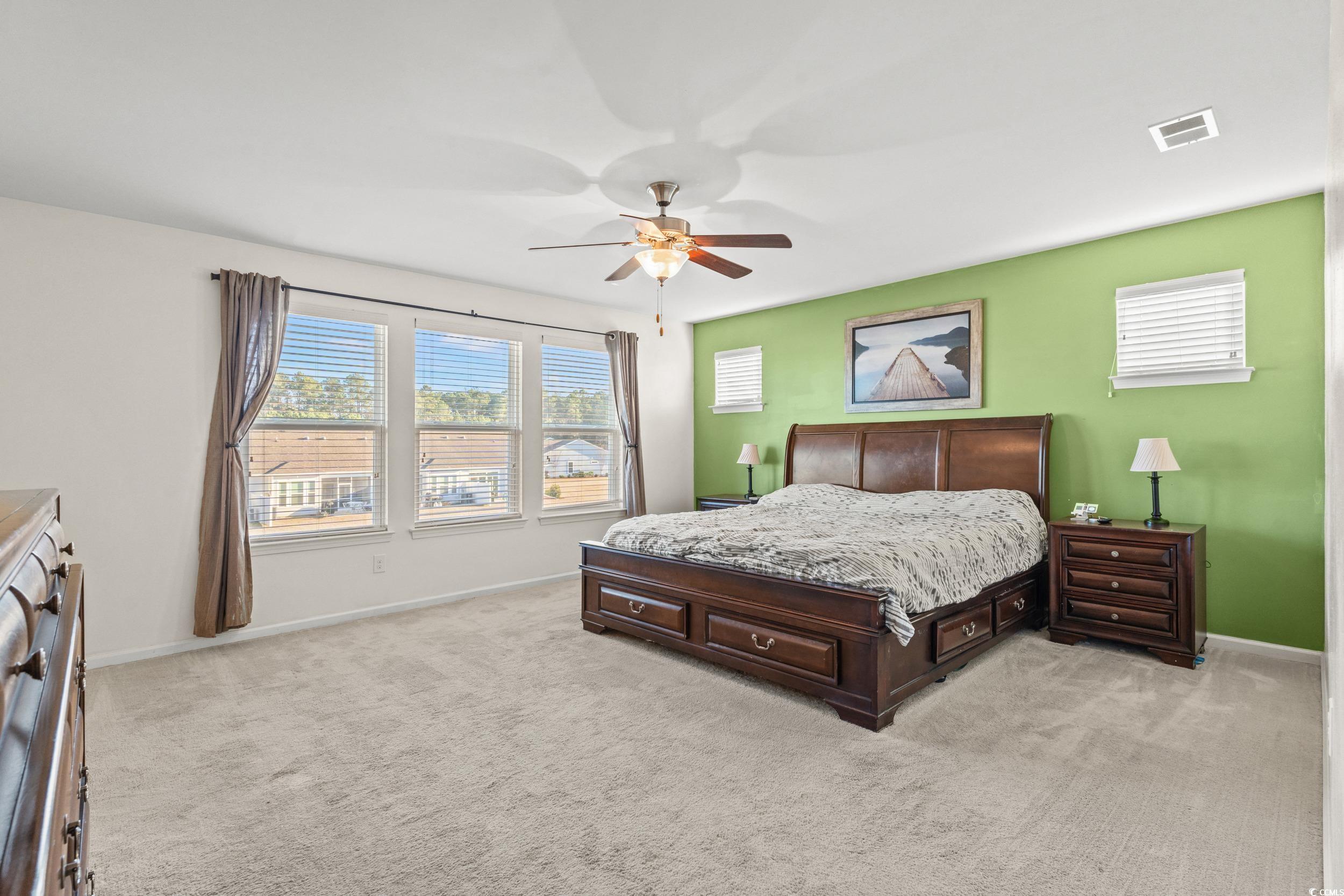 556 Majorca Loop Myrtle Beach, SC 29579 - Photo 12 of 31 Carpeted bedroom featuring ceiling fan