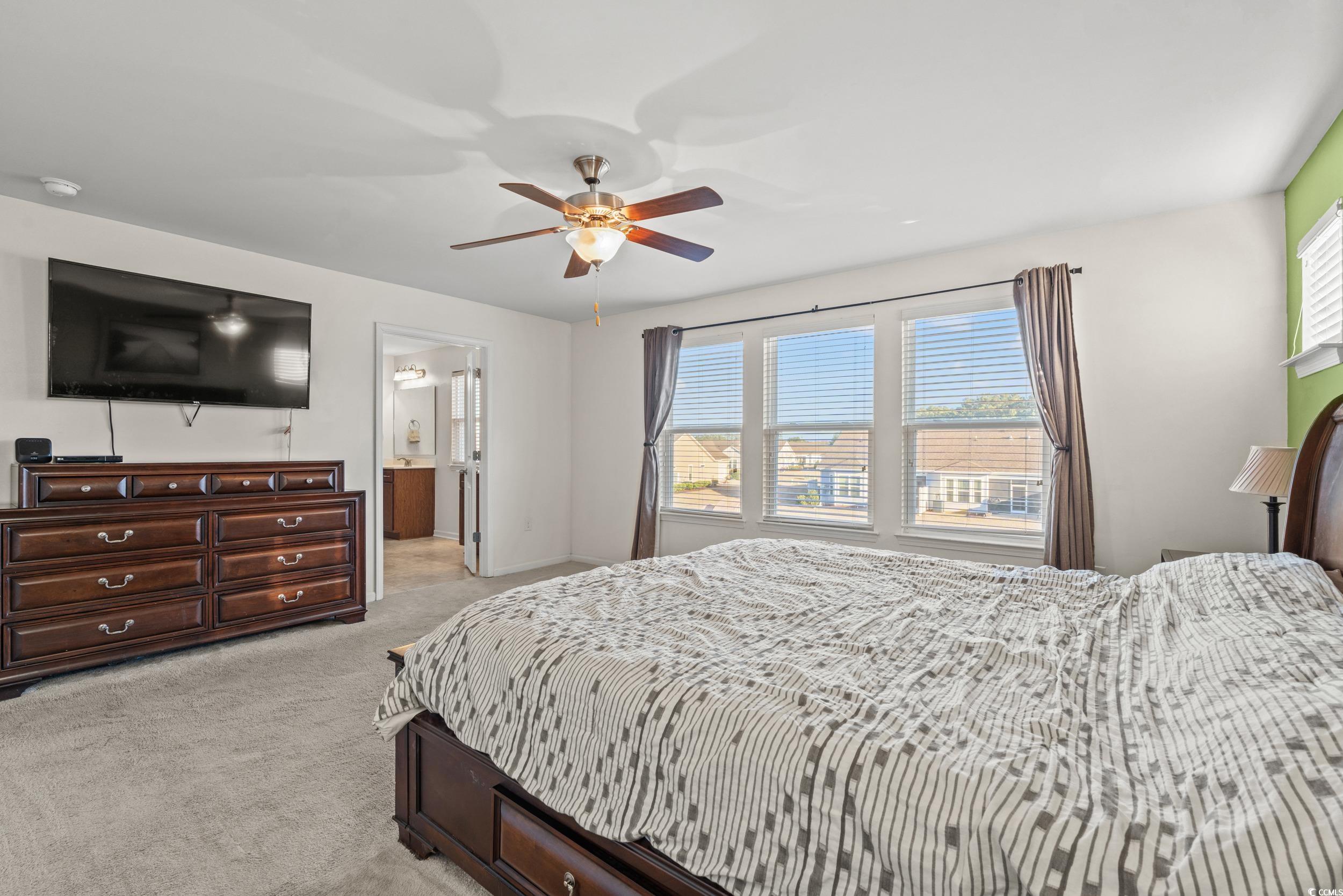 556 Majorca Loop Myrtle Beach, SC 29579 - Photo 13 of 31 Bedroom featuring ceiling fan, light colored carpe