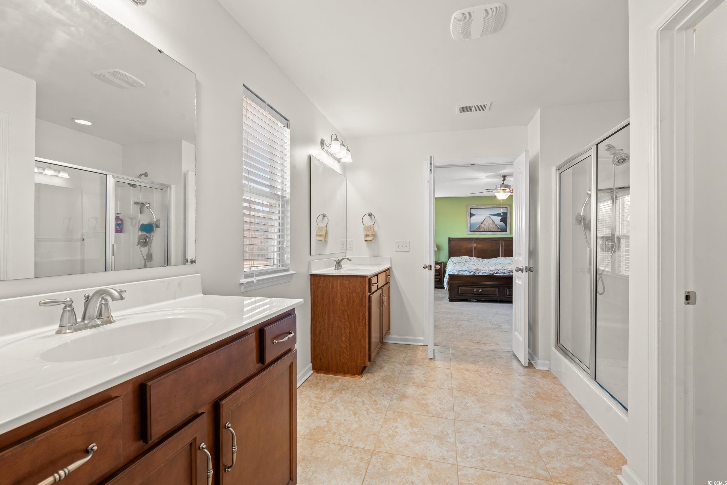 556 Majorca Loop Myrtle Beach, SC 29579 - Photo 14 of 31 Bathroom featuring vanity, tile patterned floors,