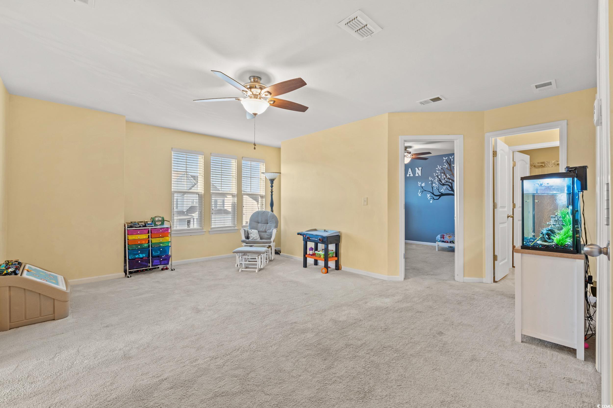 556 Majorca Loop Myrtle Beach, SC 29579 - Photo 17 of 31 Rec room featuring light carpet and ceiling fan