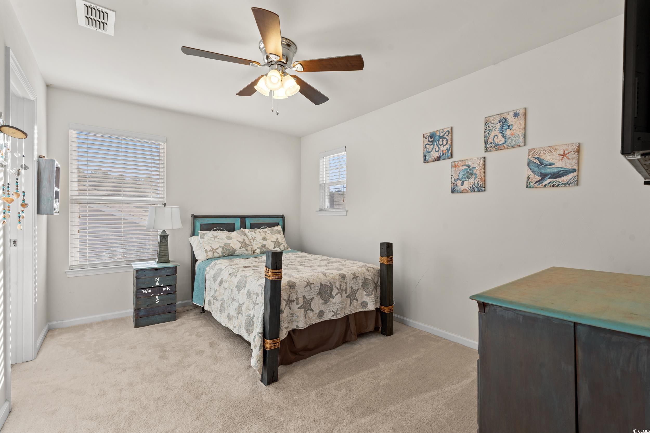 556 Majorca Loop Myrtle Beach, SC 29579 - Photo 18 of 31 Carpeted bedroom featuring ceiling fan