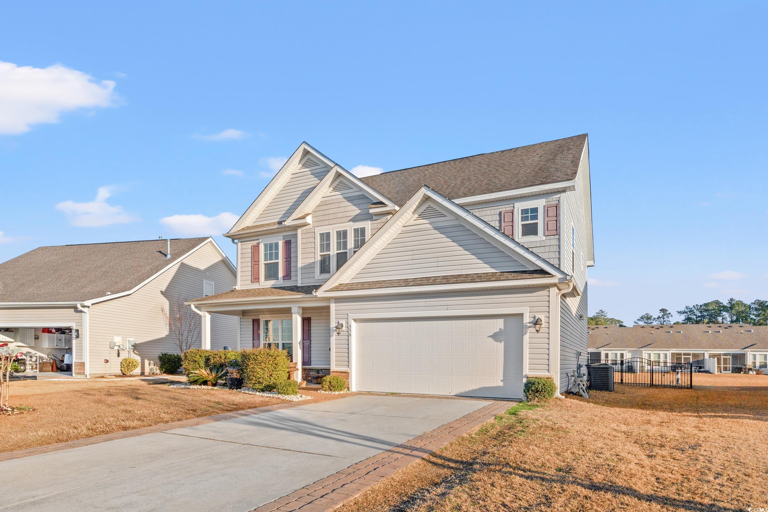 556 Majorca Loop Myrtle Beach, SC 29579 - Photo 2 of 31 View of front of property with a garage and a fron
