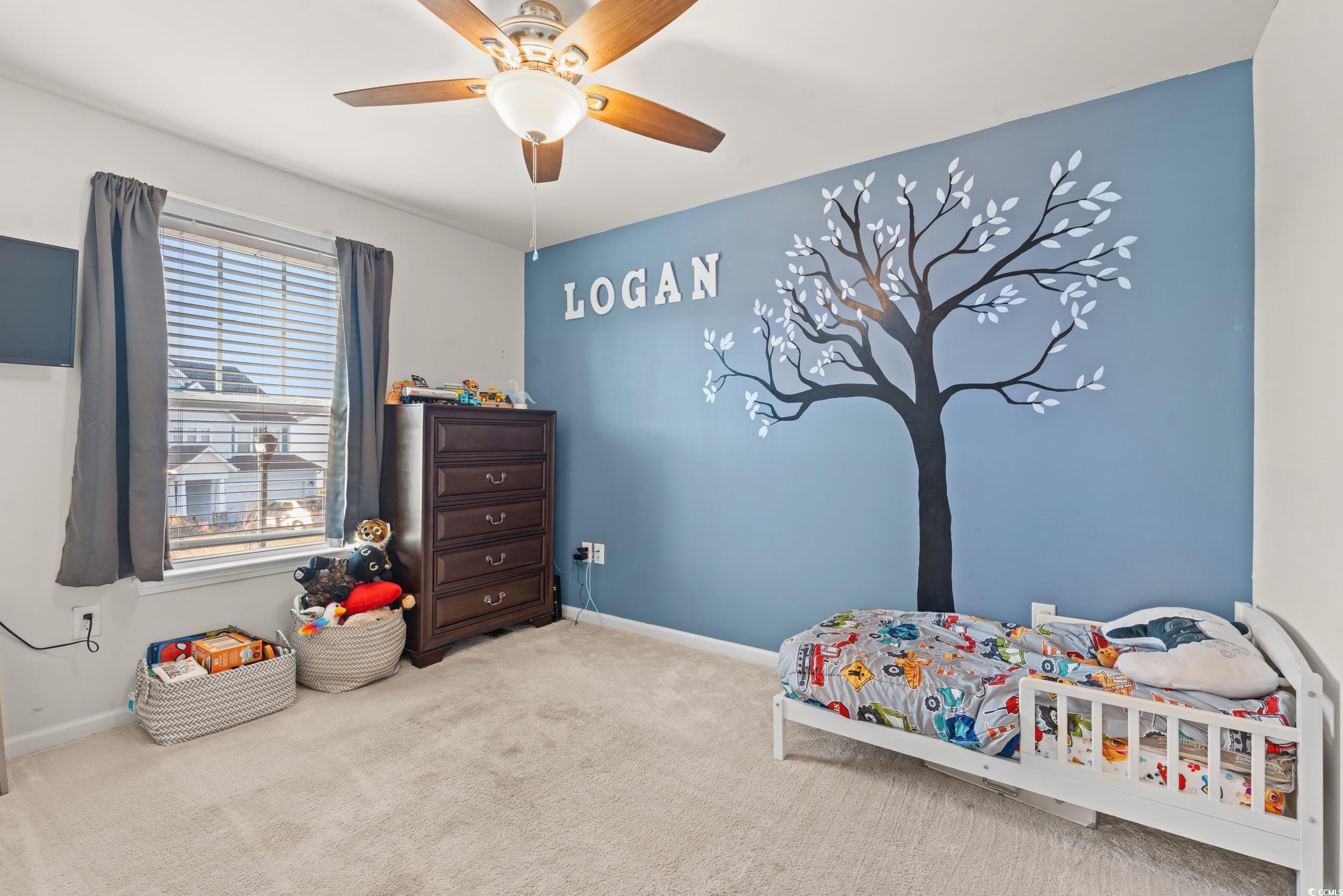 556 Majorca Loop Myrtle Beach, SC 29579 - Photo 21 of 31 Bedroom featuring ceiling fan and light carpet