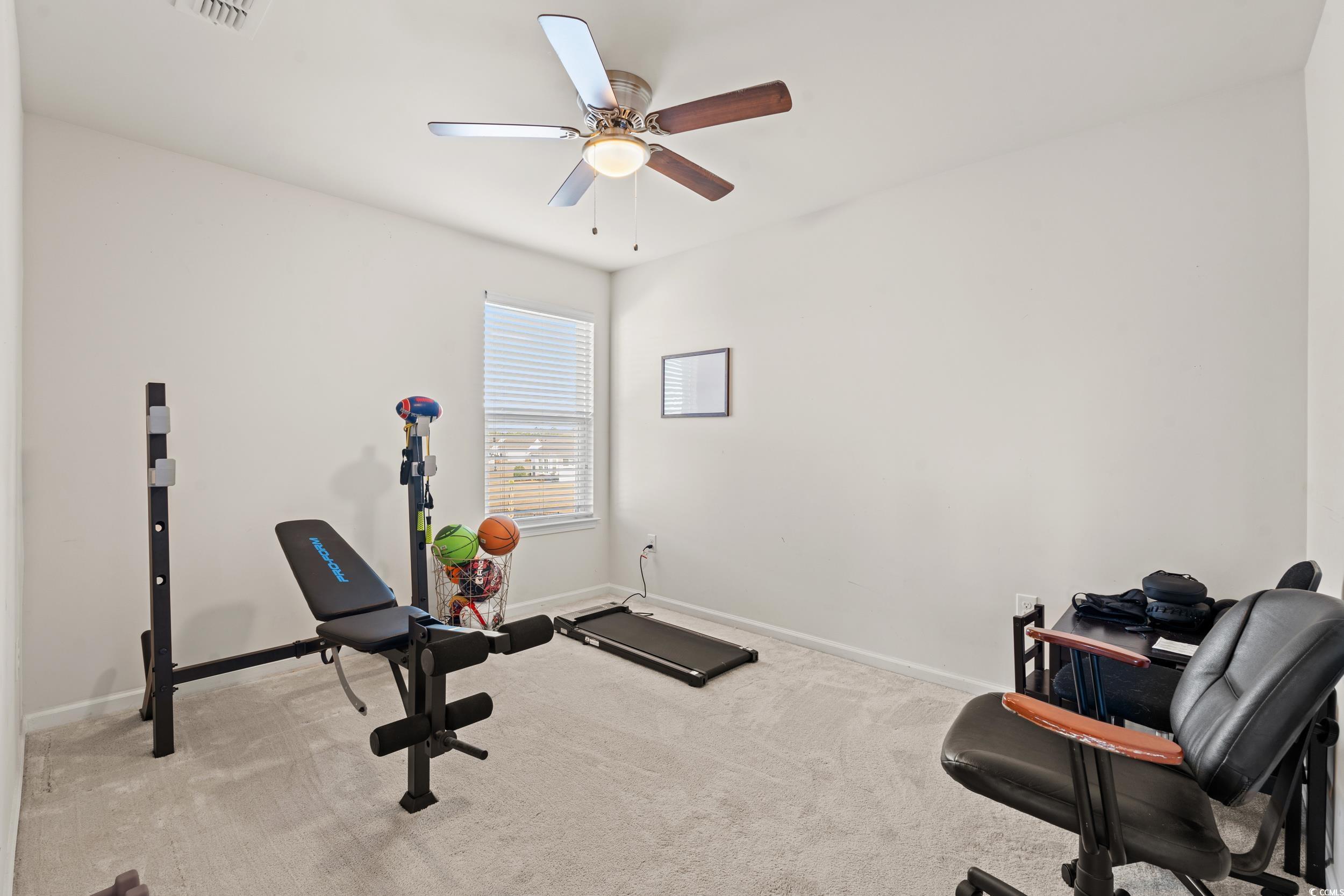 556 Majorca Loop Myrtle Beach, SC 29579 - Photo 23 of 31 Workout room with light carpet and ceiling fan