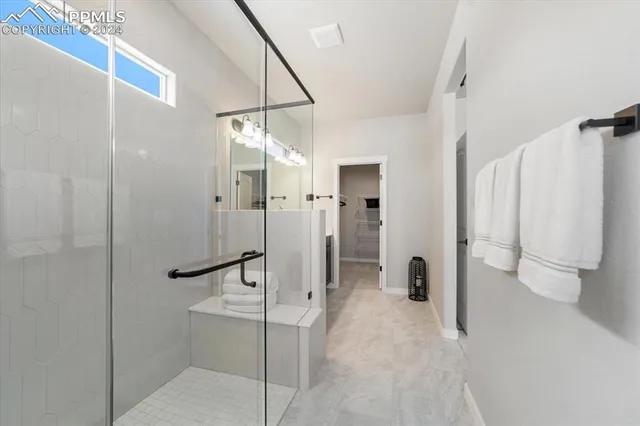 a bathroom with a shower and toilet