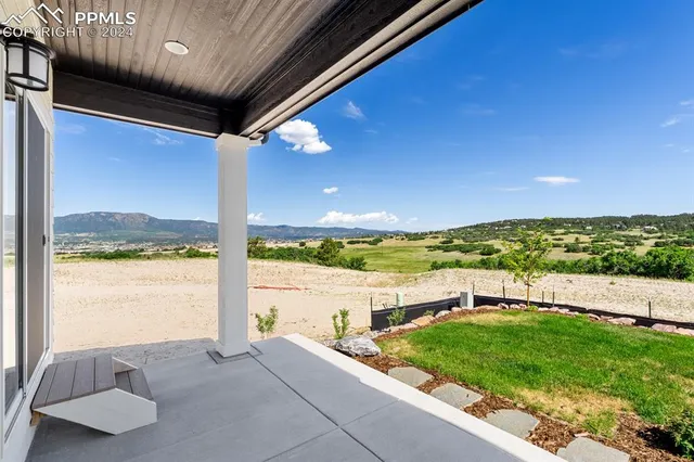 a view of balcony with furniture