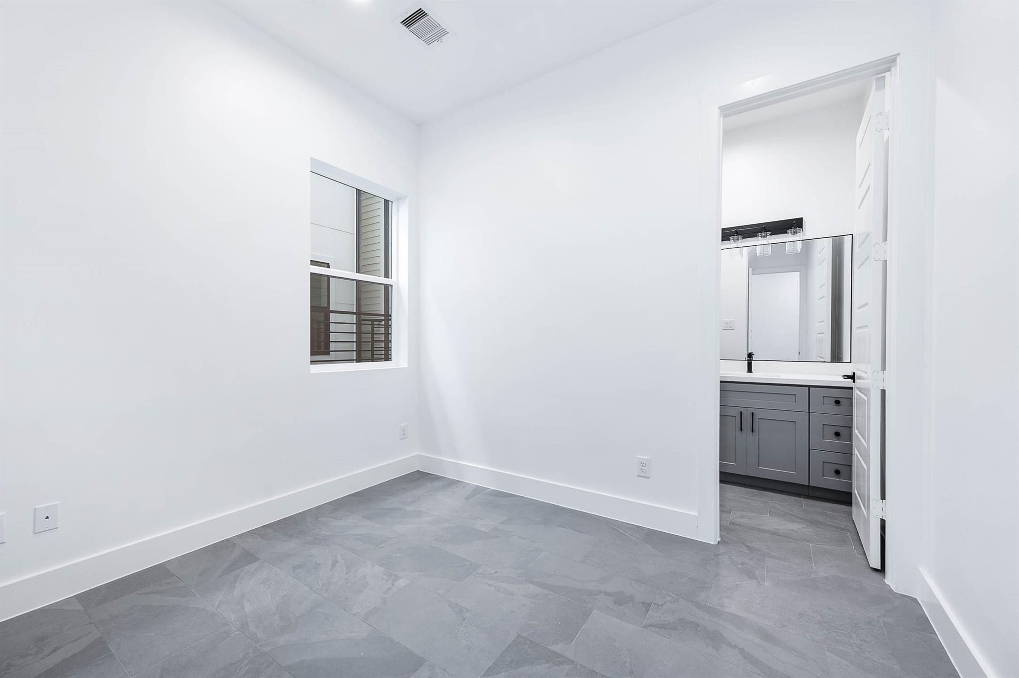 1711 Milby Street Houston, TX 77003 - Photo 9 of 12 an empty room with a bathroom and a sink