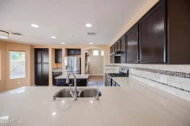 a large bathroom with a double vanity sink and mirror