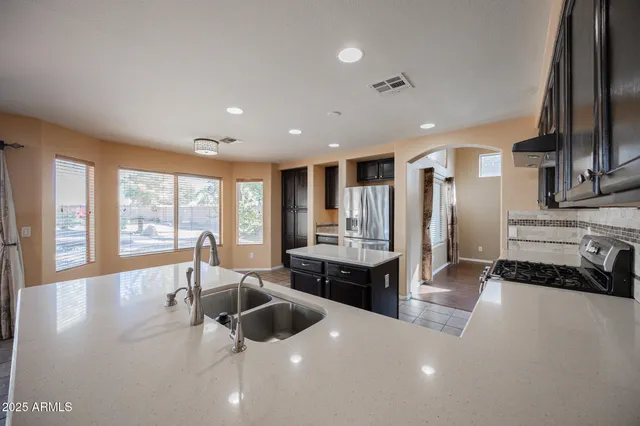a bathroom with a tub sink and a shower