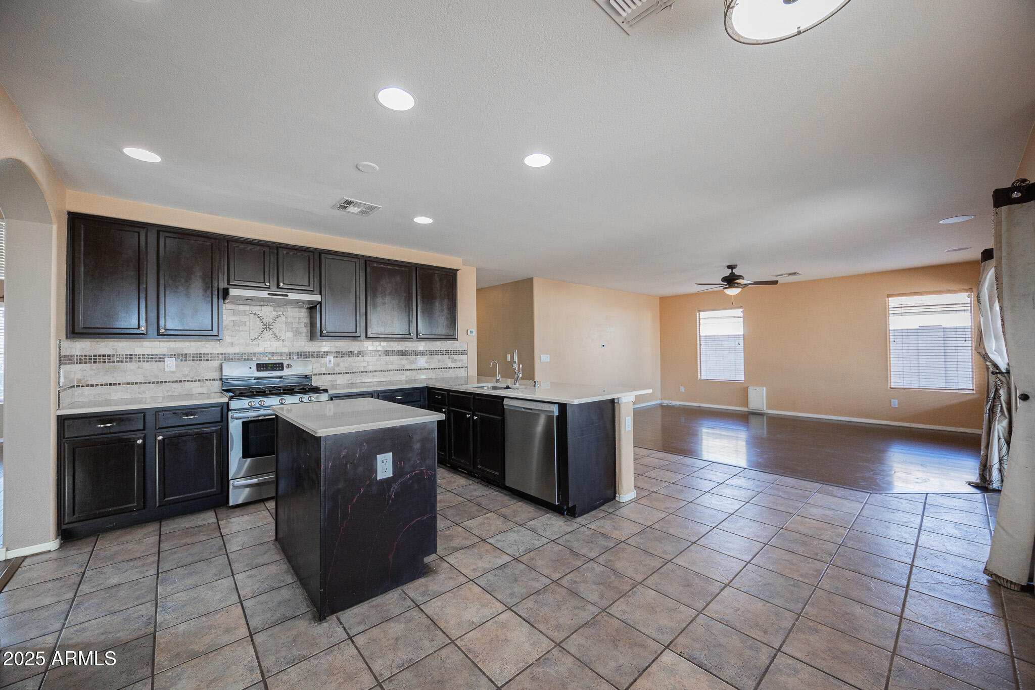 2300 East Augusta Avenue Chandler, AZ 85249 - Photo 17 of 53 a kitchen with a sink a counter top space and appliances