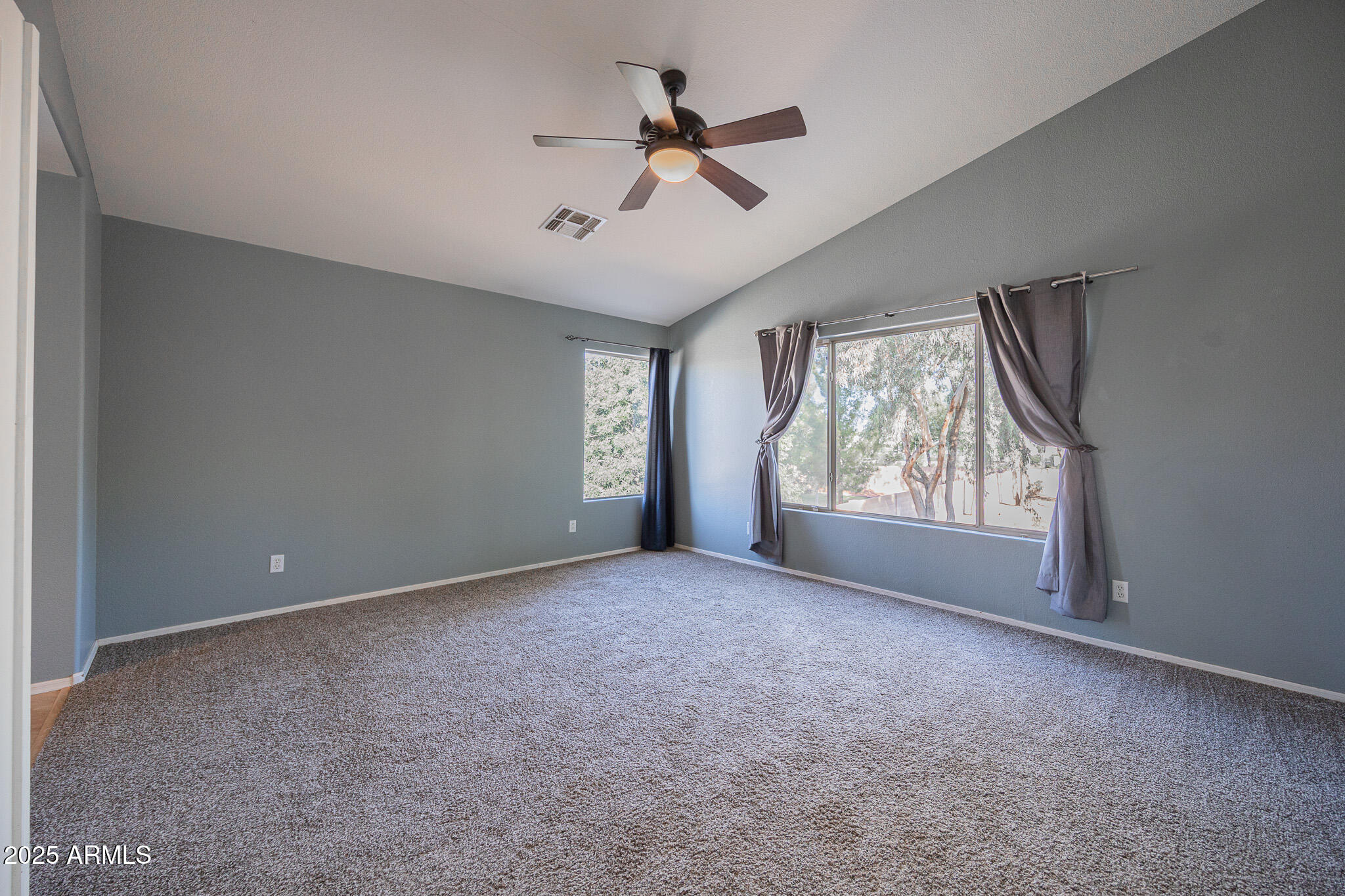 2300 East Augusta Avenue Chandler, AZ 85249 - Photo 19 of 53 a view of a livingroom with a ceiling fan and window