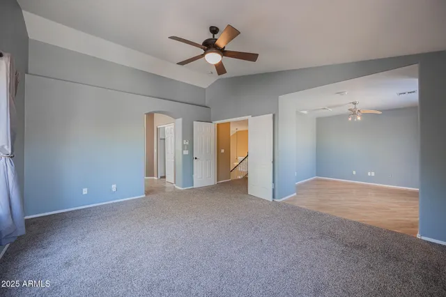 a white toilet sitting next to a bath tub