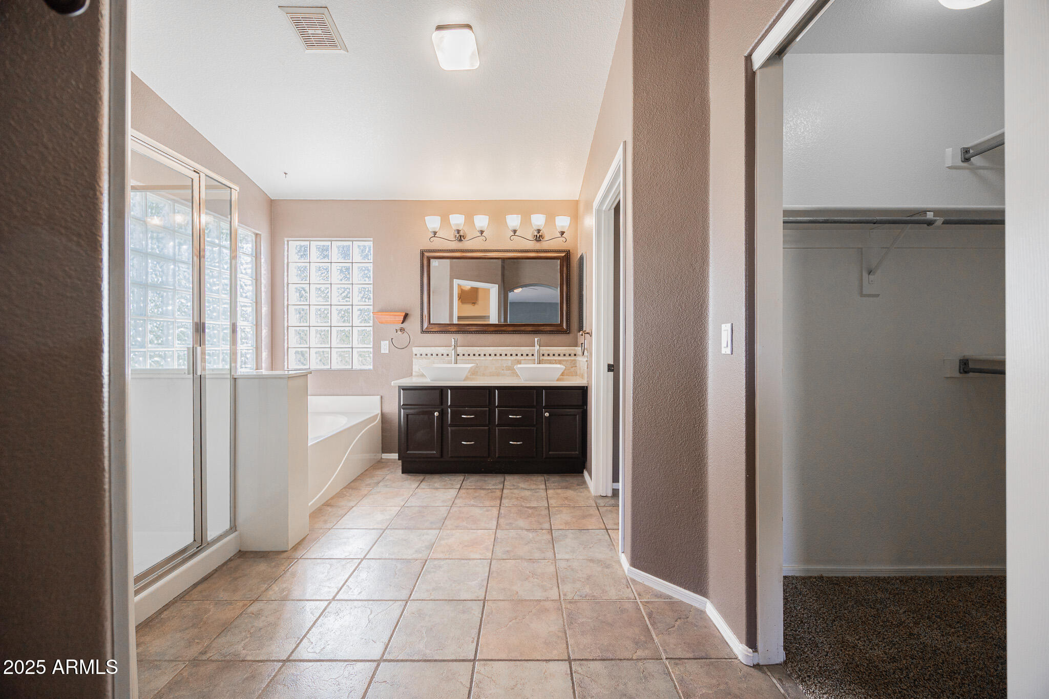 2300 East Augusta Avenue Chandler, AZ 85249 - Photo 25 of 53 a large bathroom with a double vanity sink and mirror