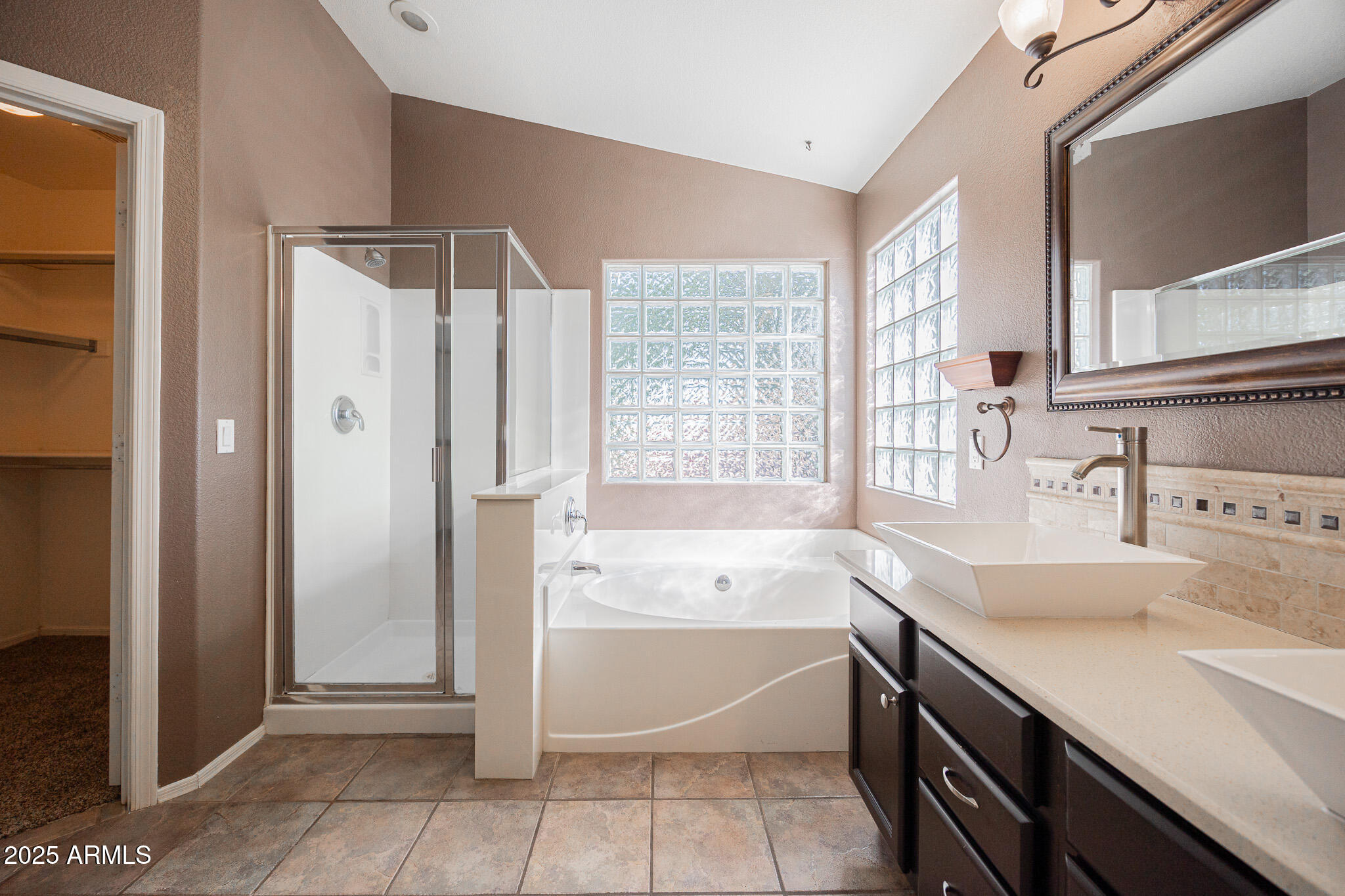 2300 East Augusta Avenue Chandler, AZ 85249 - Photo 28 of 53 a bathroom with a tub sink and a shower