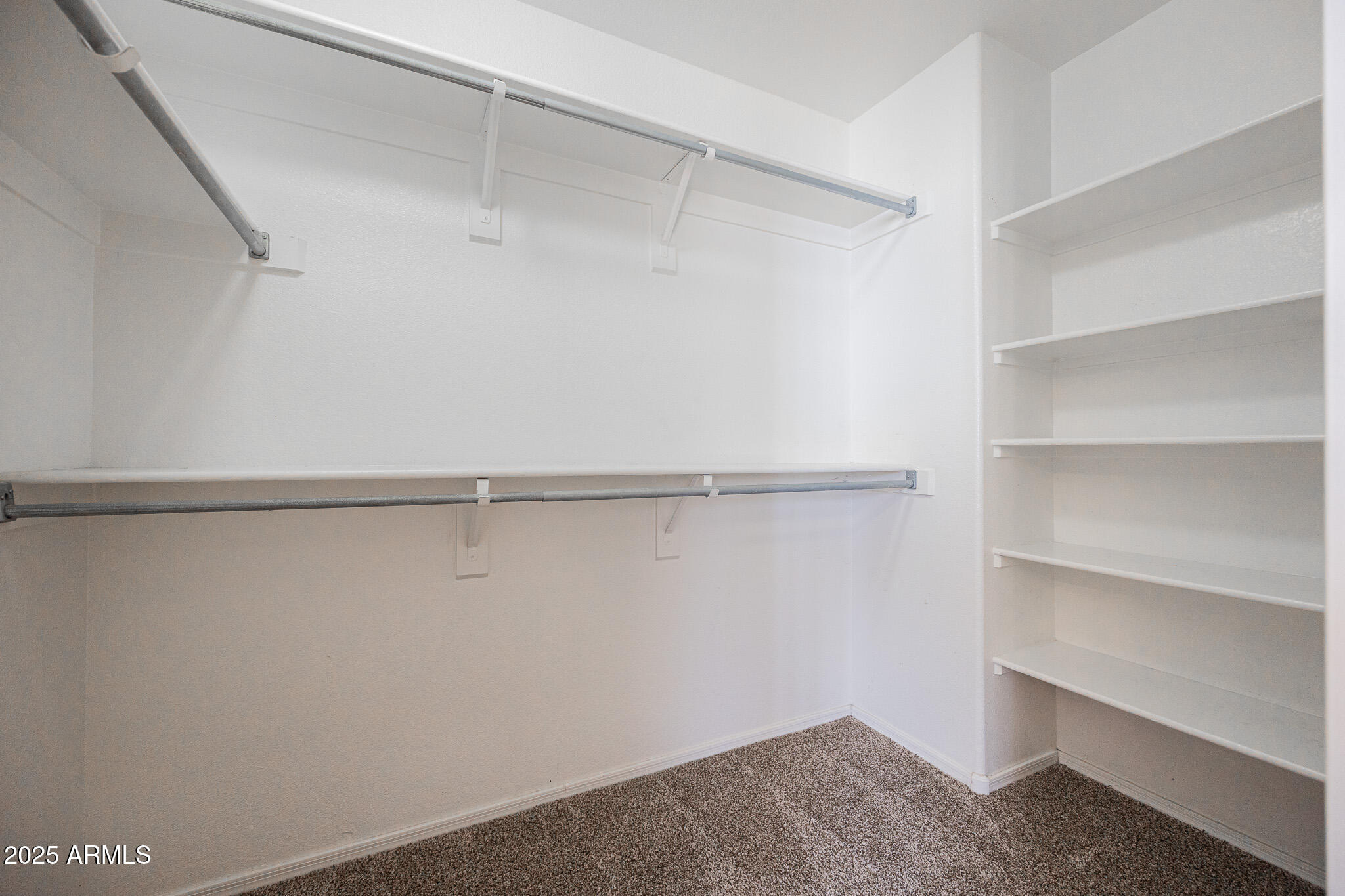 2300 East Augusta Avenue Chandler, AZ 85249 - Photo 29 of 53 a view of walk in closet with empty racks