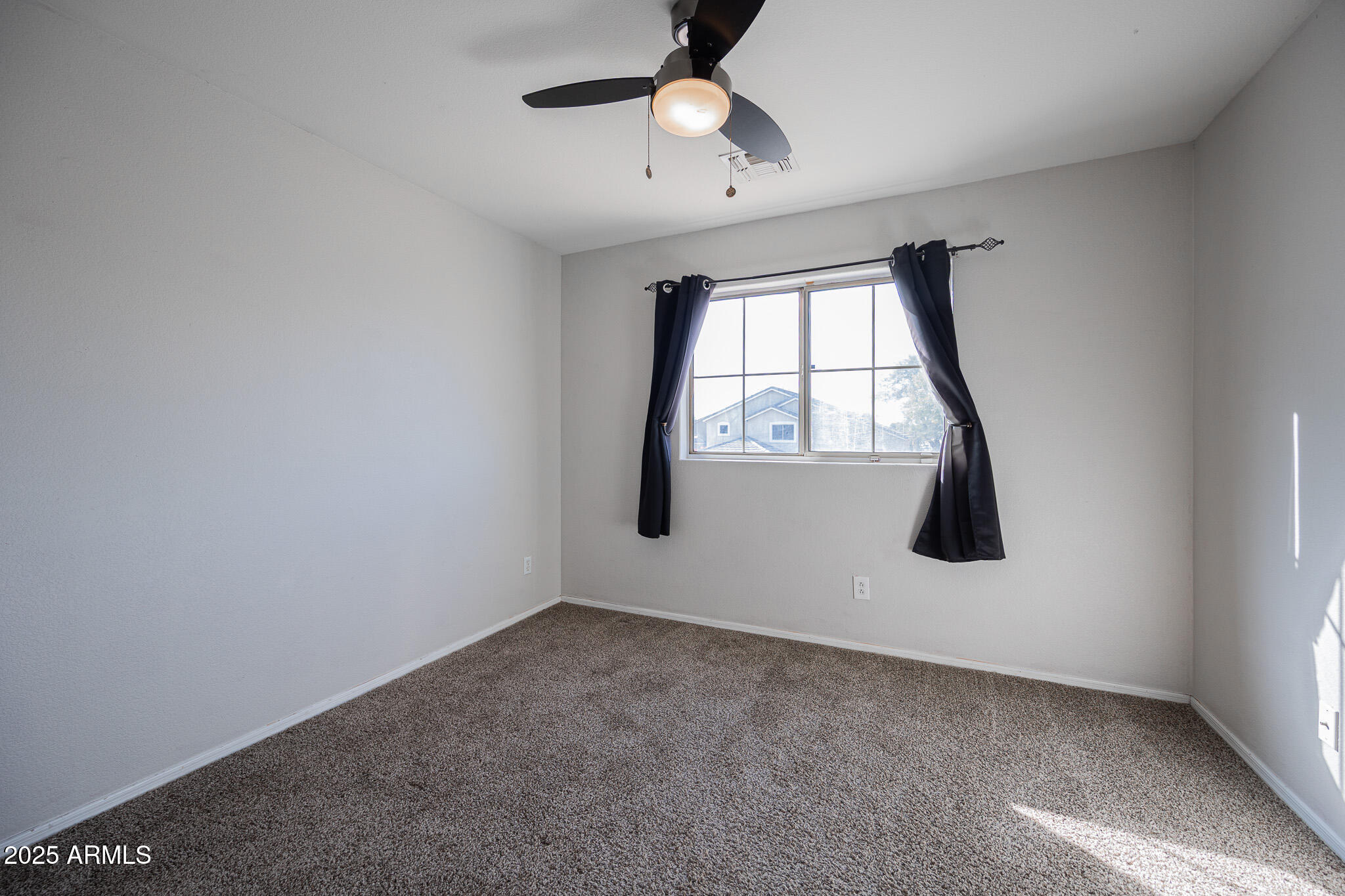 2300 East Augusta Avenue Chandler, AZ 85249 - Photo 30 of 53 an empty room with windows and fan