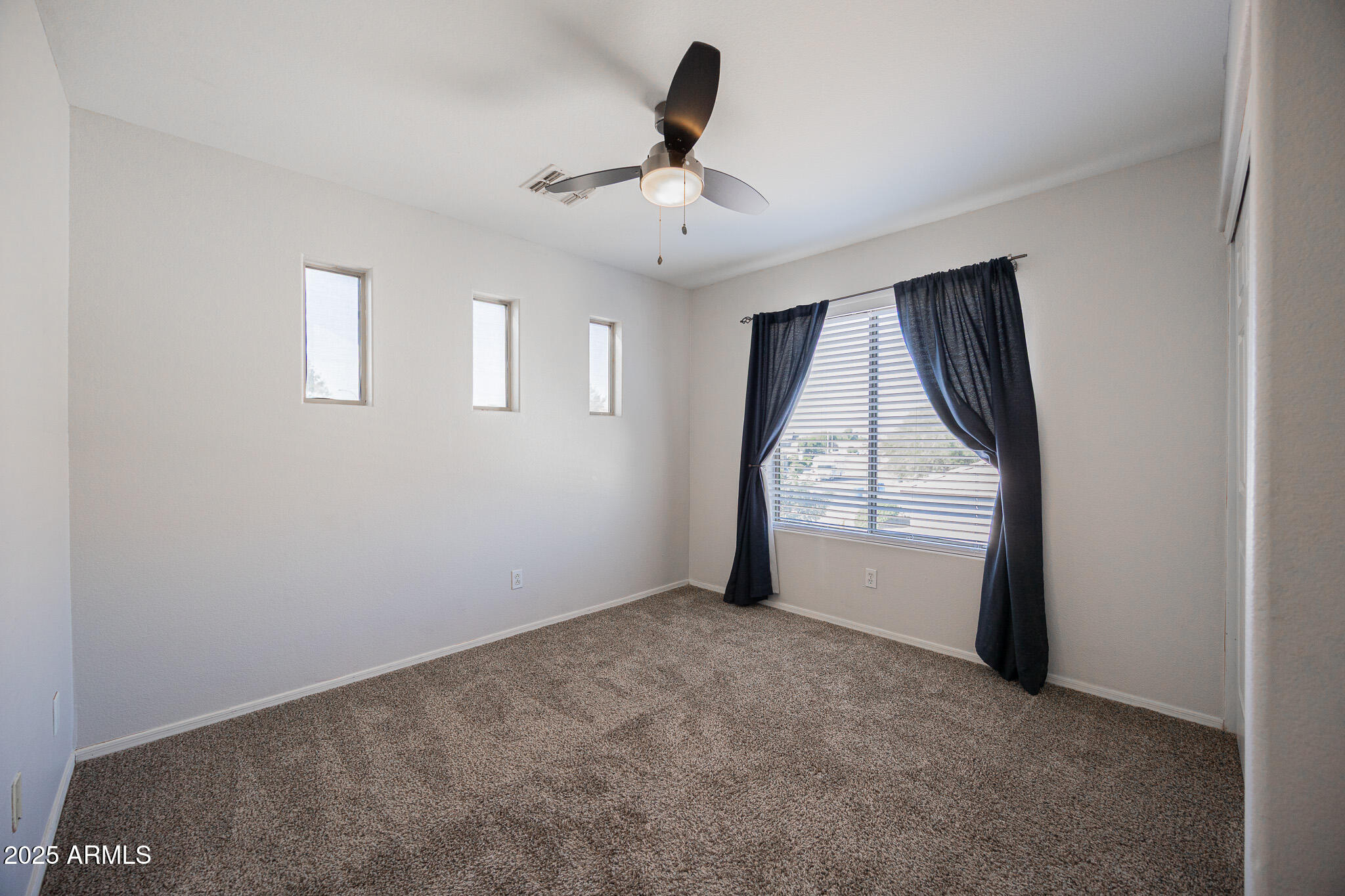 2300 East Augusta Avenue Chandler, AZ 85249 - Photo 34 of 53 an empty room with windows and closet