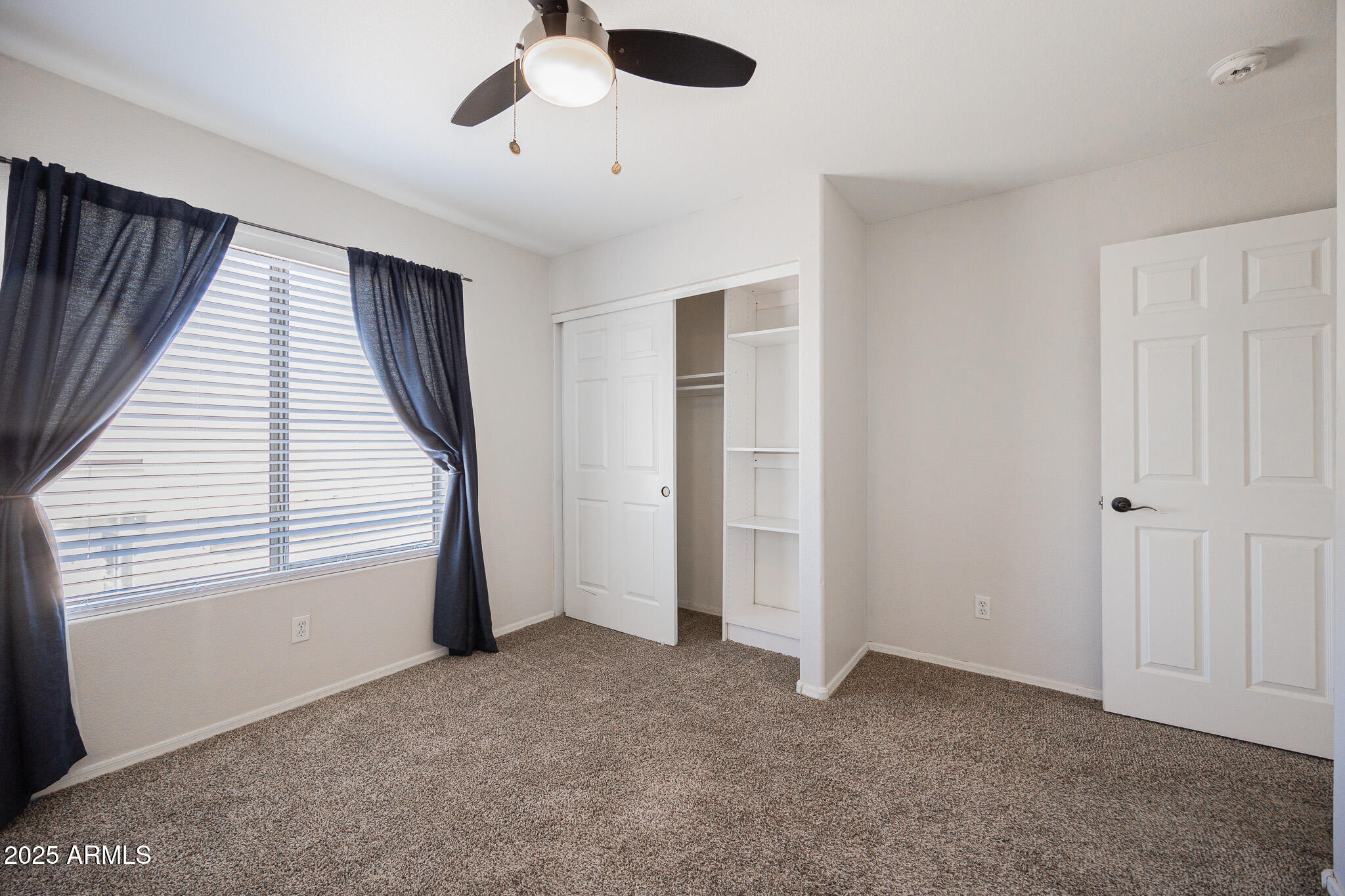 2300 East Augusta Avenue Chandler, AZ 85249 - Photo 36 of 53 a view of a livingroom with a ceiling fan and window