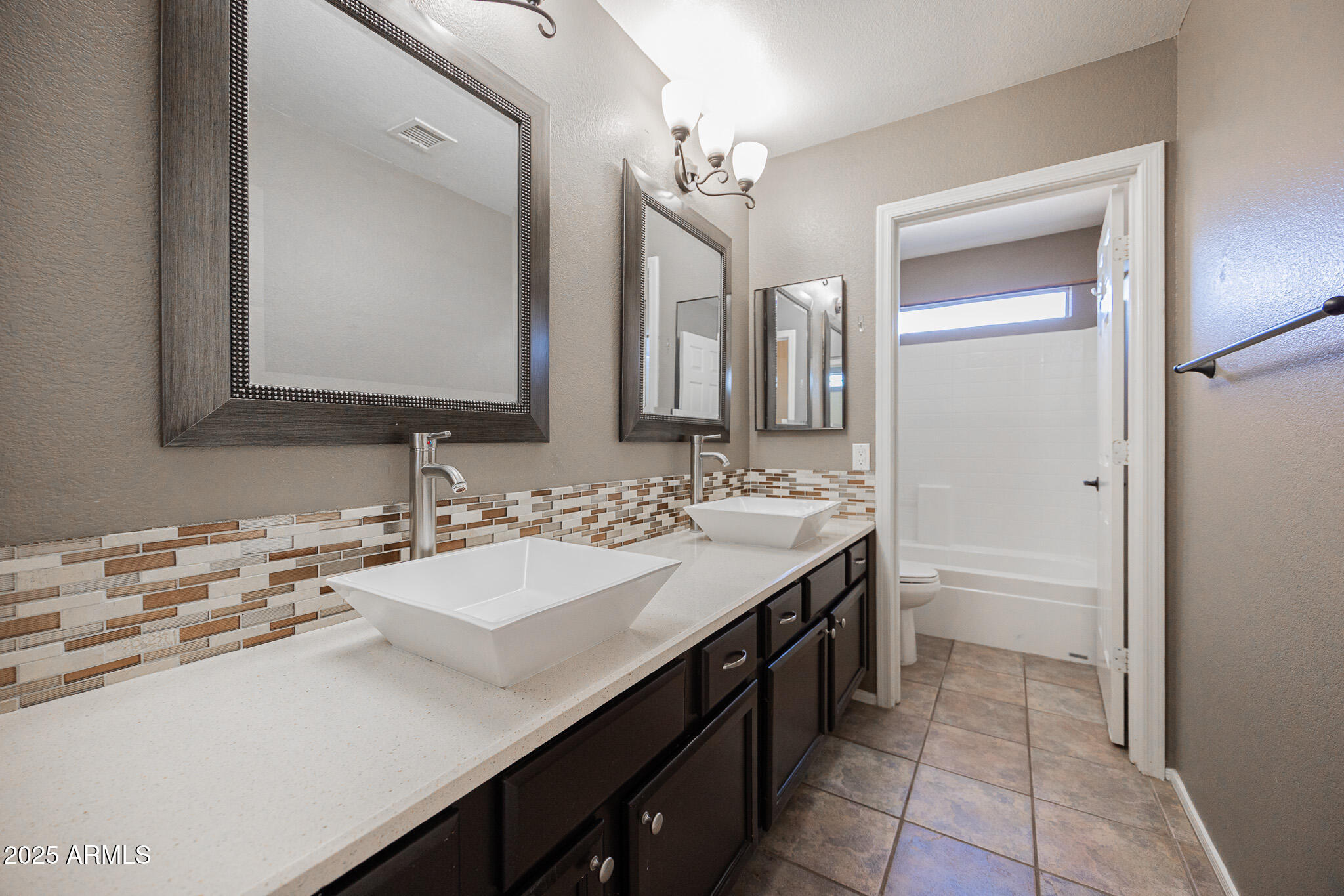 2300 East Augusta Avenue Chandler, AZ 85249 - Photo 37 of 53 a bathroom with a sink double vanity and a mirror