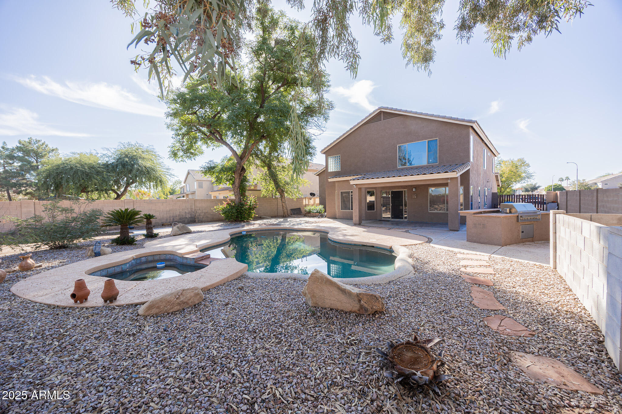 2300 East Augusta Avenue Chandler, AZ 85249 - Photo 50 of 53 a backyard of a house with yard fire pit and outdoor seating