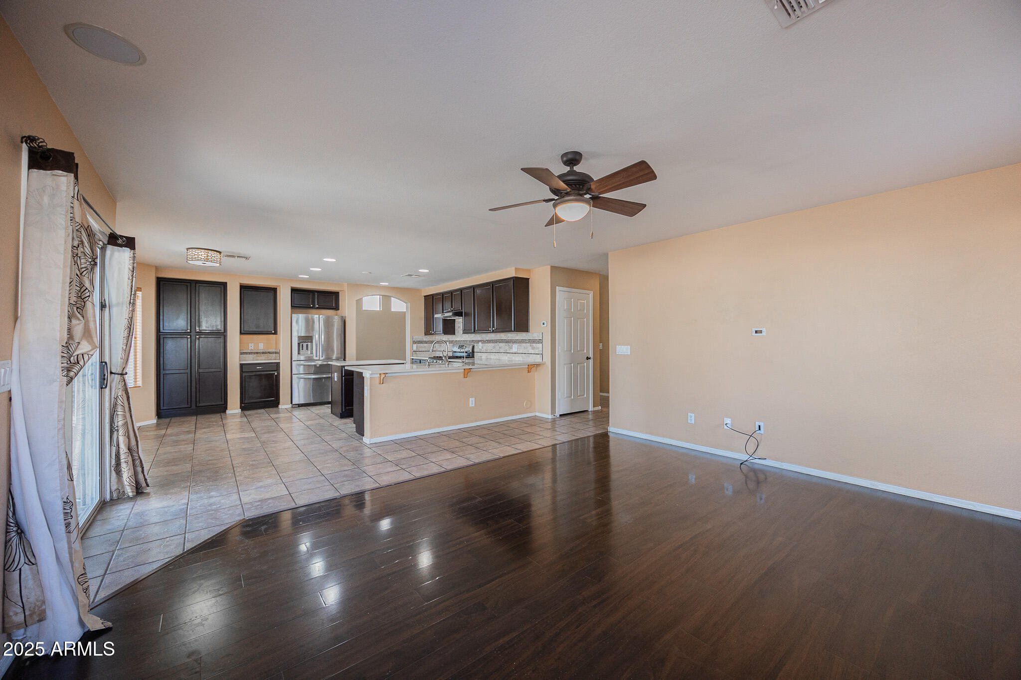 2300 East Augusta Avenue Chandler, AZ 85249 - Photo 9 of 53 a view of a kitchen with a sink and a refrigerator