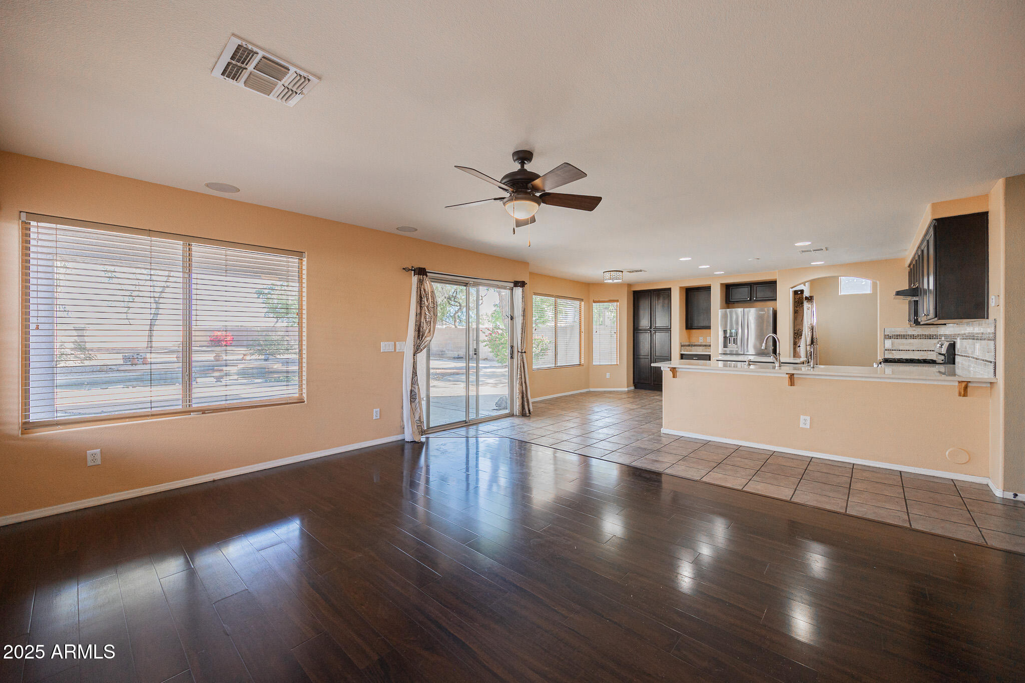 2300 East Augusta Avenue Chandler, AZ 85249 - Photo 10 of 53 a view of an empty room with wooden floor and a window