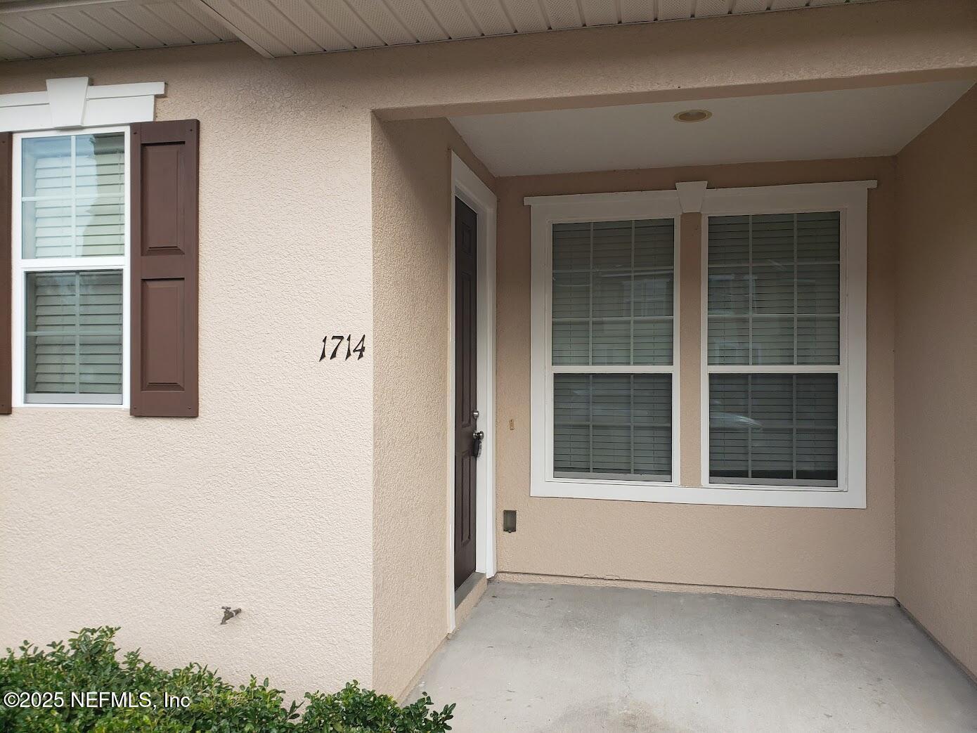4220 Plantation Oaks Boulevard, Unit 1714 Orange Park, FL 32065 - Photo 2 of 11 a view of an empty room with a window