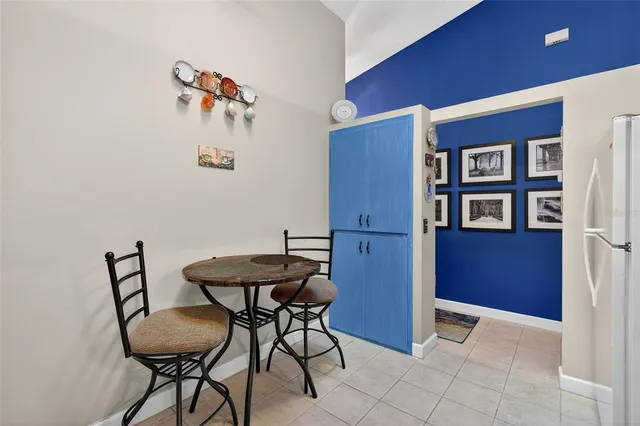 a view of a room with furniture and wooden floor