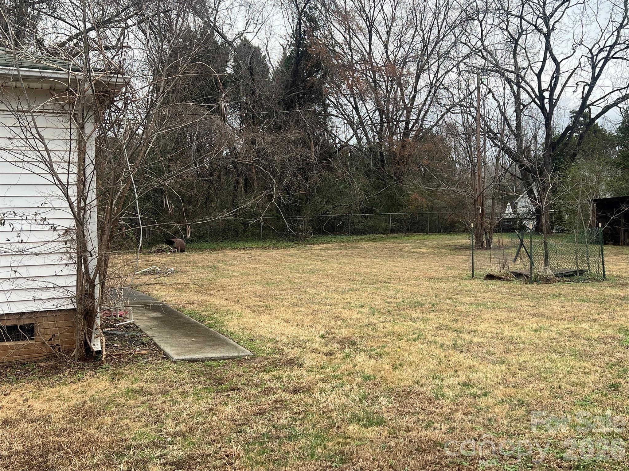 9970 Harrisburg Road Fort Mill, SC 29707 - Photo 5 of 9 a view of a yard with a house