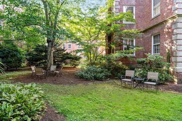 a view of a backyard with sitting area and furniture