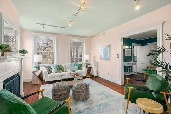 a living room with furniture and a fireplace