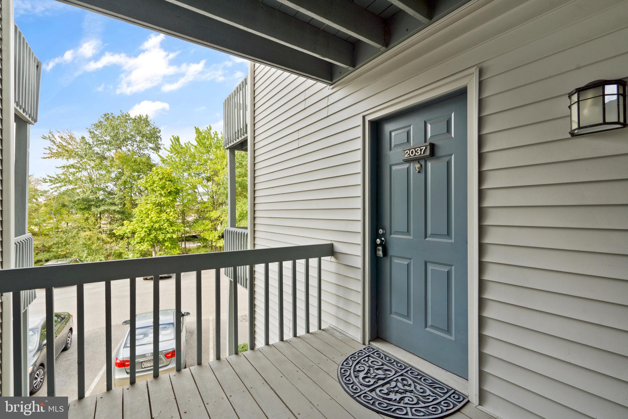 a view of a balcony with wooden floor