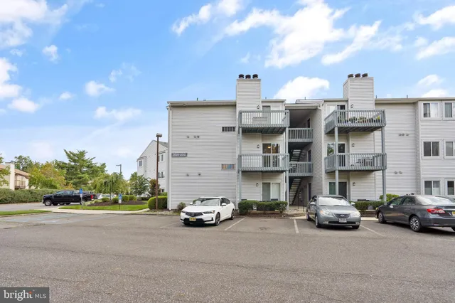 a view of a cars parked in front of a building
