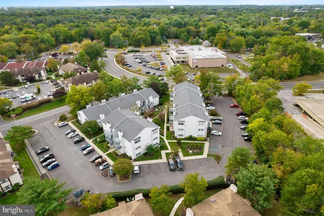 an aerial view of residential house with outdoor space and swimming pool
