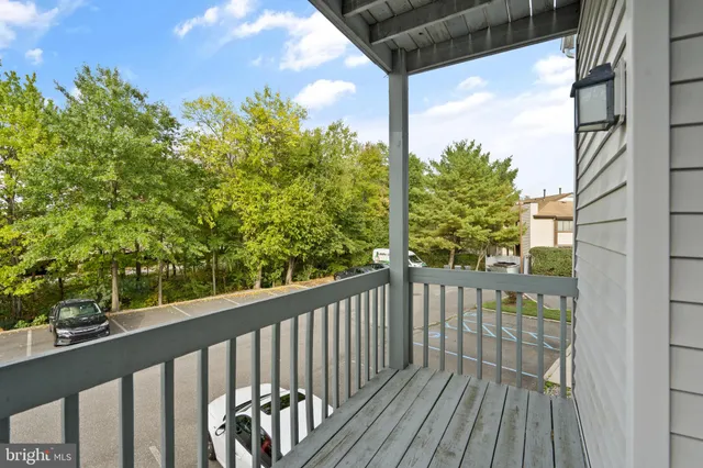 a view of a balcony with wooden floor