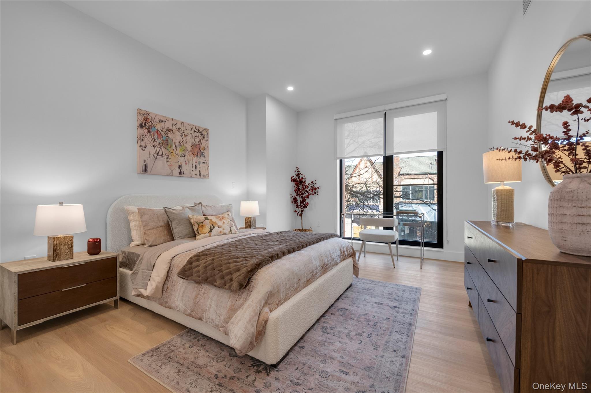 108 Middle Neck Road, Unit 4G Great Neck, NY 11021 - Photo 3 of 9 a spacious bedroom with a balcony a bed and a large window