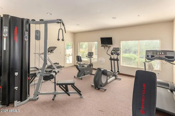 a view of a livingroom with furniture and a flat screen tv