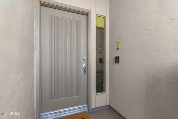 a view of a bathroom from a hallway