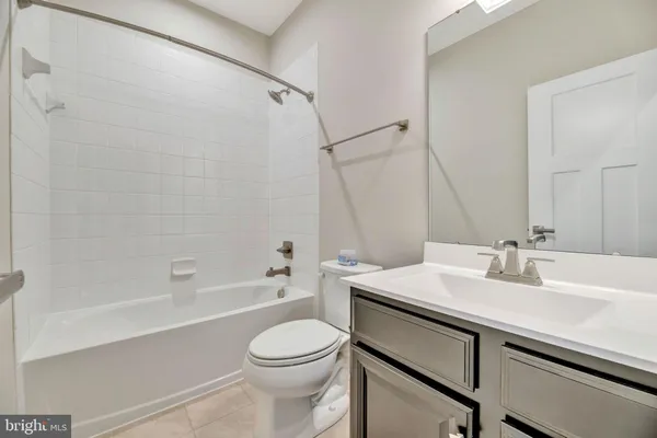 a bathroom with a sink a toilet and a bathtub