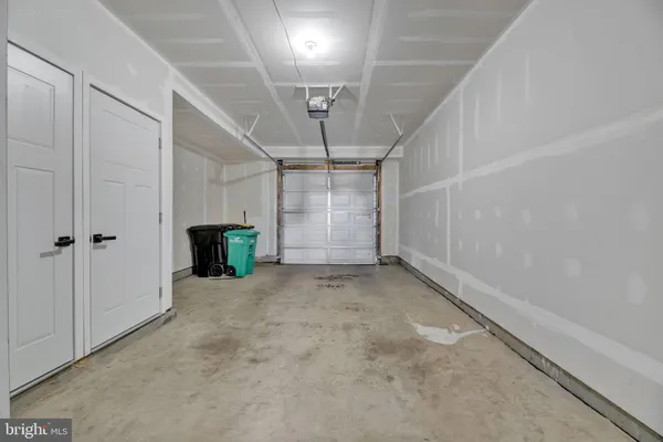 a view of an empty room with a fireplace