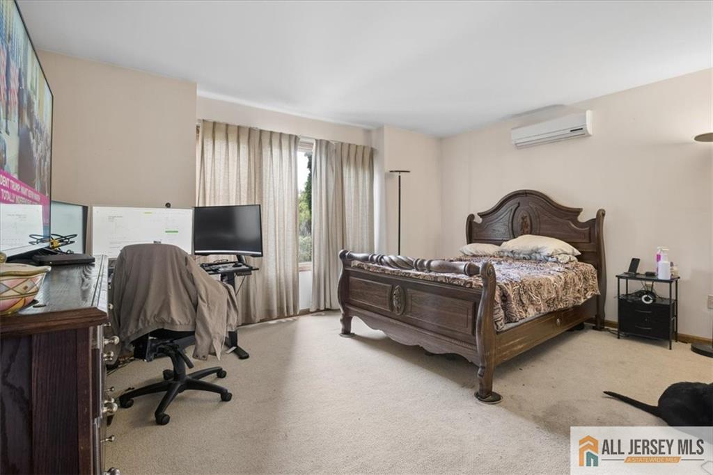 167 Federal Road Monroe Township, NJ 08831 - Photo 18 of 46 a bedroom with a bed and a desk