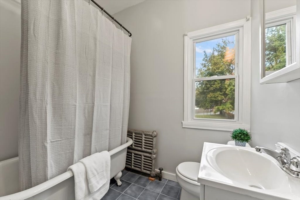 554 Broadway Street Chicopee, MA 01020 - Photo 23 of 42 a bathroom with a sink toilet and shower