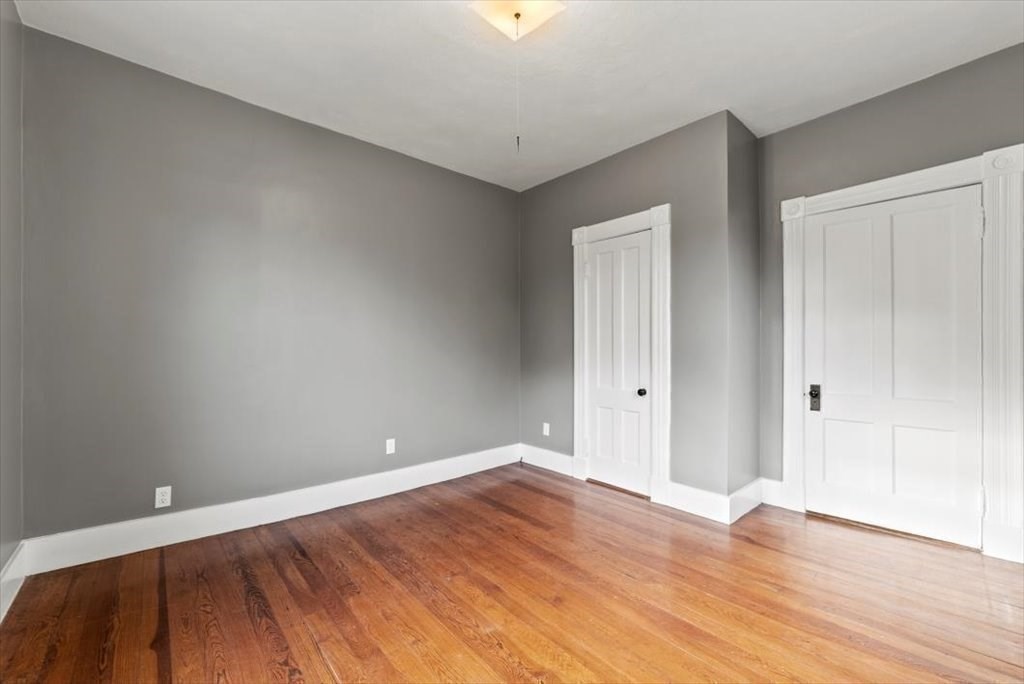 554 Broadway Street Chicopee, MA 01020 - Photo 33 of 42 a view of an empty room with wooden floor