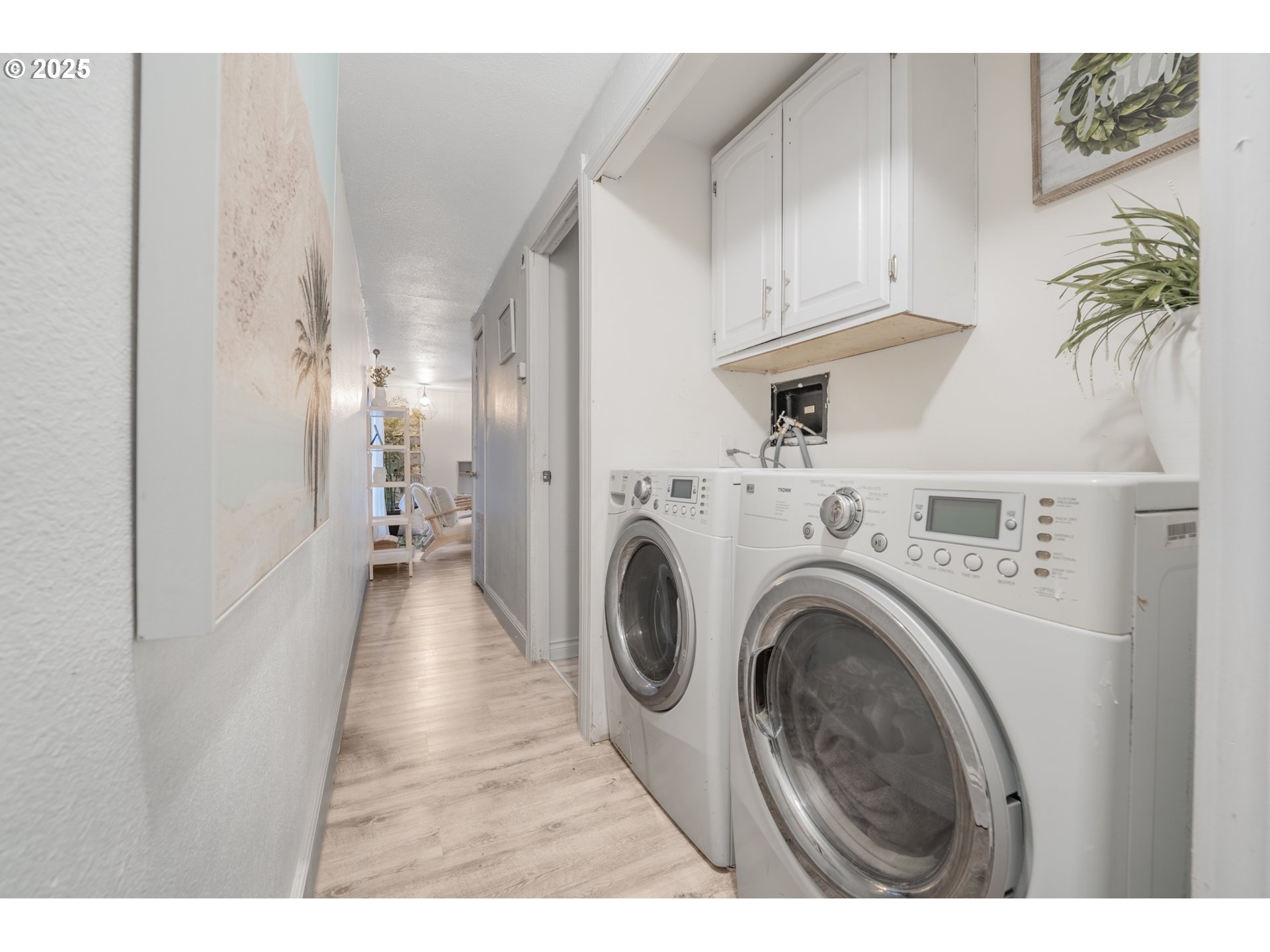 2012 Kennedy Circle Northeast, Unit 10 Keizer, OR 97303 - Photo 11 of 21 a view of a hallway with washer and dryer