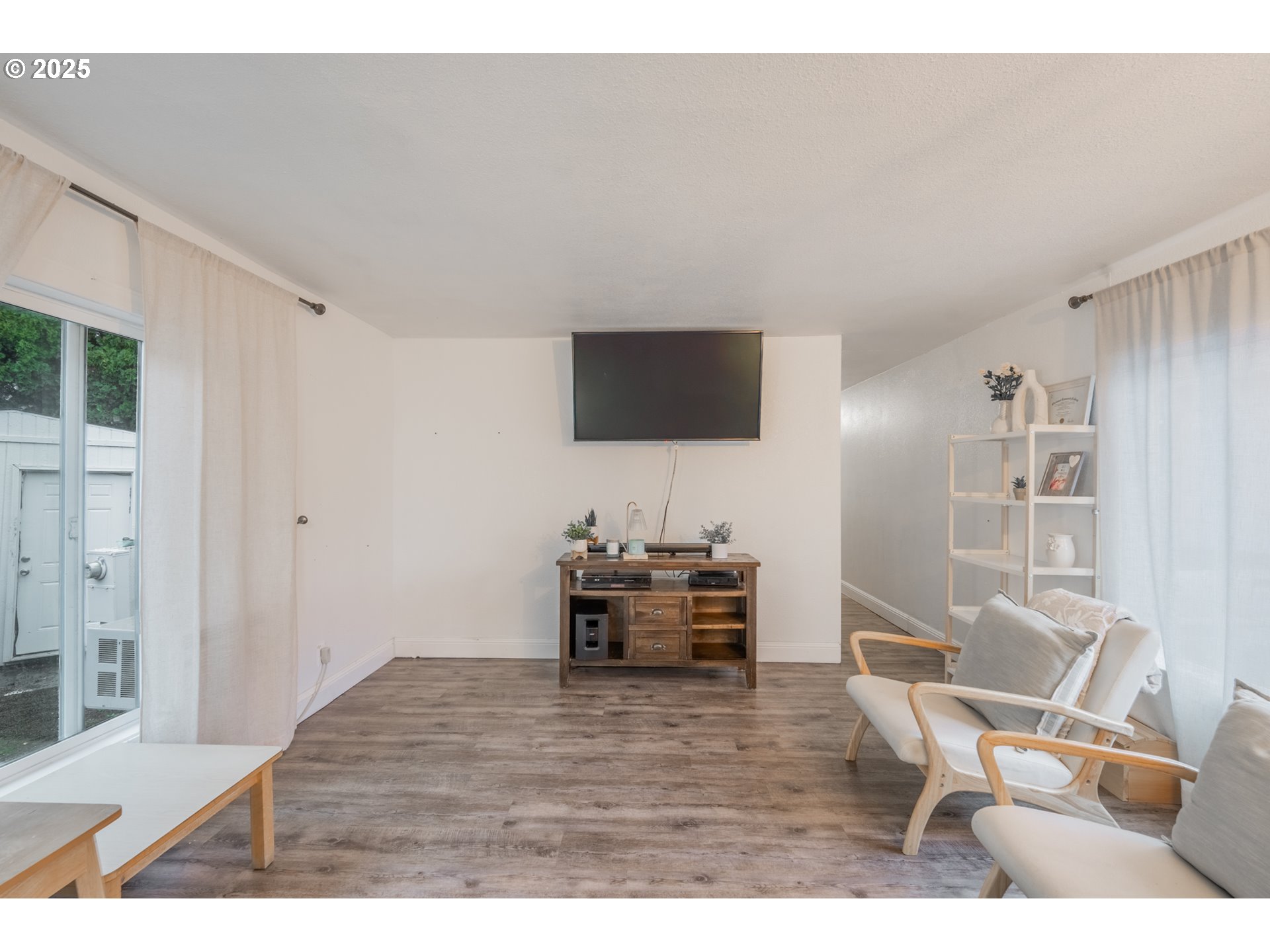 2012 Kennedy Circle Northeast, Unit 10 Keizer, OR 97303 - Photo 7 of 21 a living room with furniture and a flat screen tv