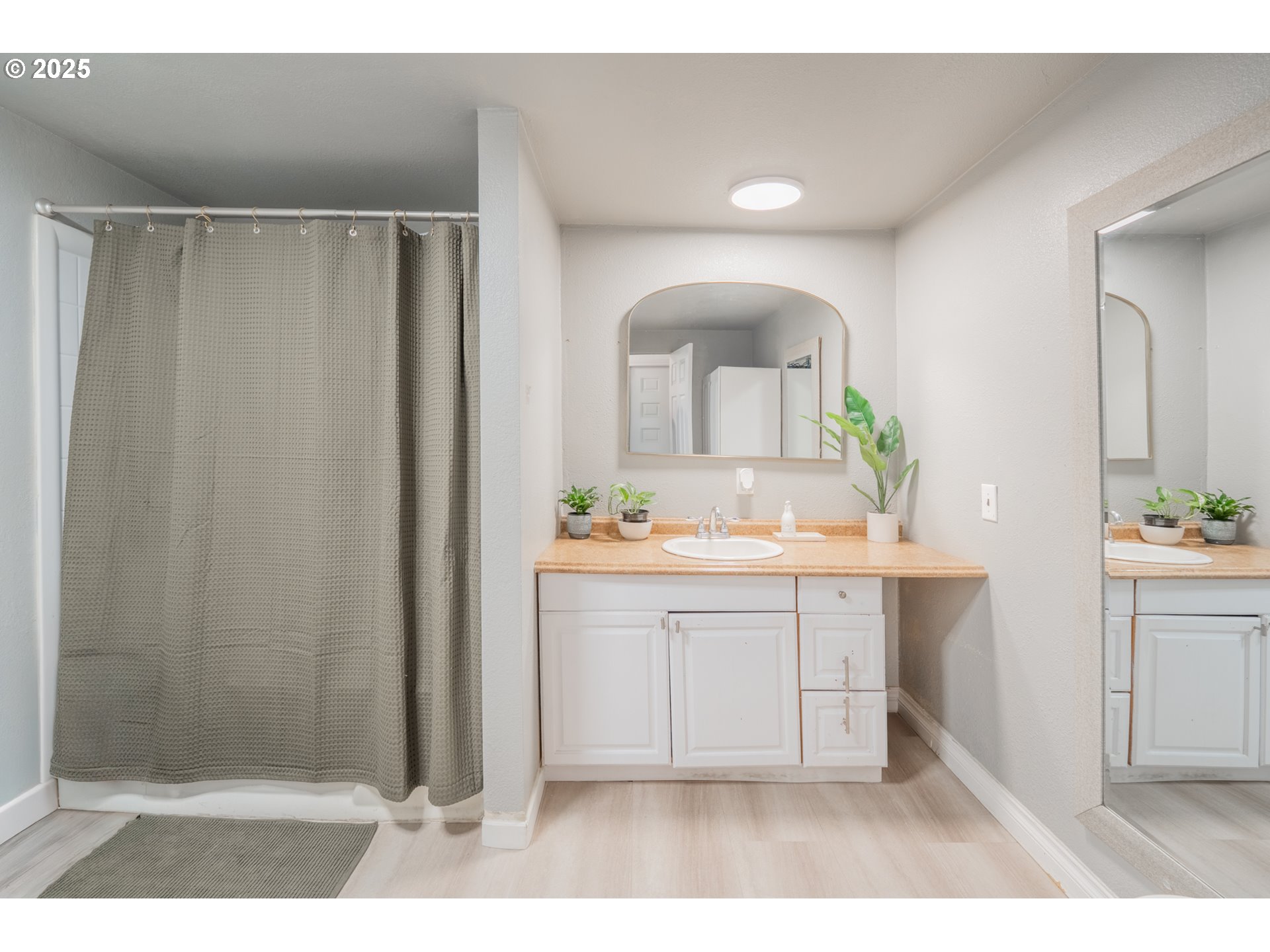 2012 Kennedy Circle Northeast, Unit 10 Keizer, OR 97303 - Photo 8 of 21 a bathroom with a sink a mirror and a shower