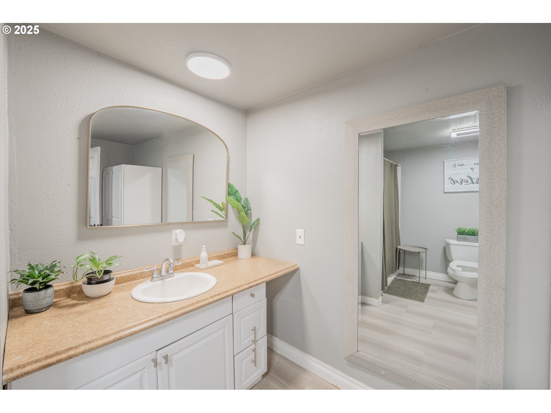 2012 Kennedy Circle Northeast, Unit 10 Keizer, OR 97303 - Photo 10 of 21 a bathroom with a sink vanity granite and a mirror