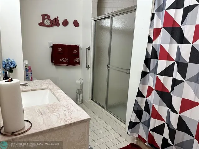 a bathroom with a sink and mirror