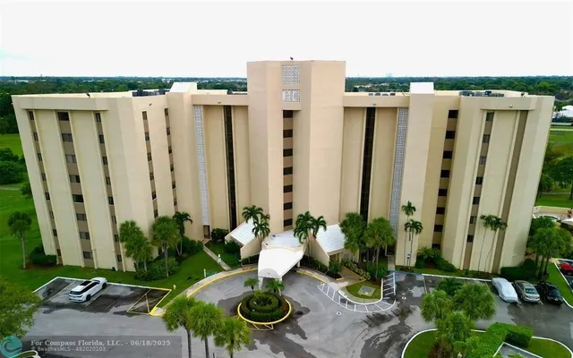 an outdoor space with patio furniture and potted plants